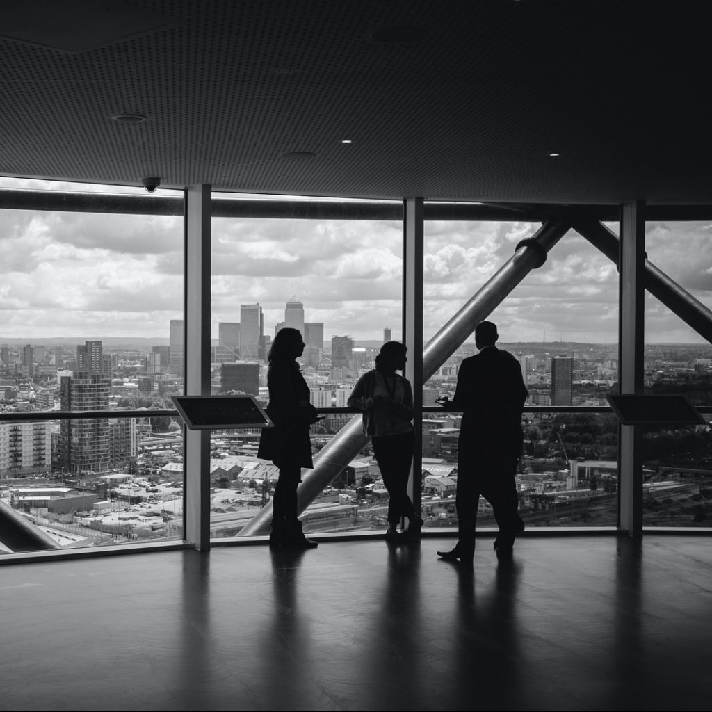 people standing inside city building